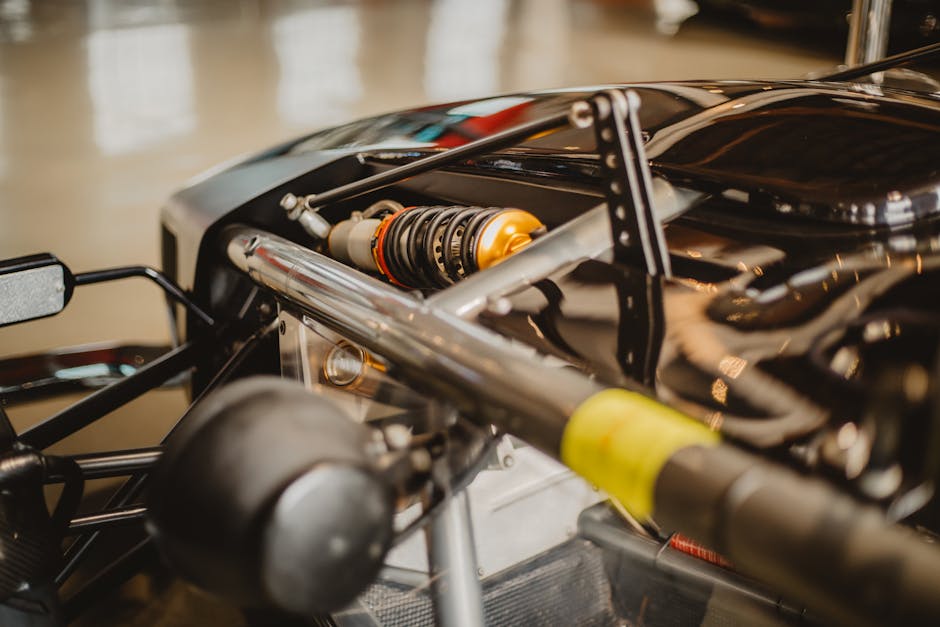 pexels-photo-5330289-5330289 Detailed shot of a Formula One car suspension, showcasing automotive engineering.