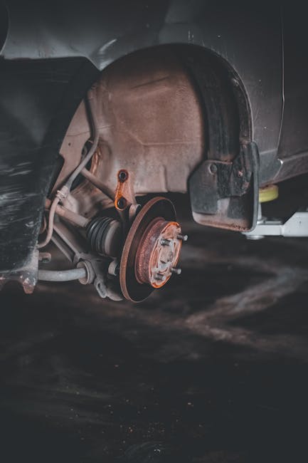 pexels-photo-8651900-8651900 Close-up of a rusty car brake system highlighting repair needs and maintenance.